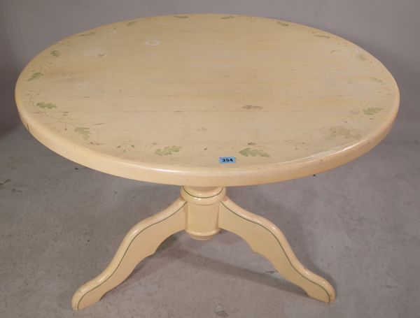 A 20th century cream painted circular dining table, 103cm wide x 77cm high.