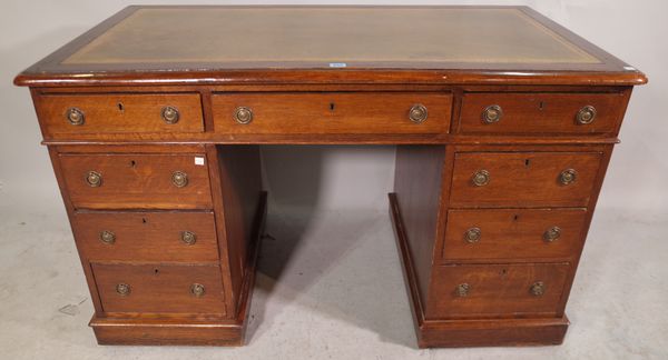 A late 19th century oak pedestal desk with tooled green leather top, 126cm wide x 72cm high.