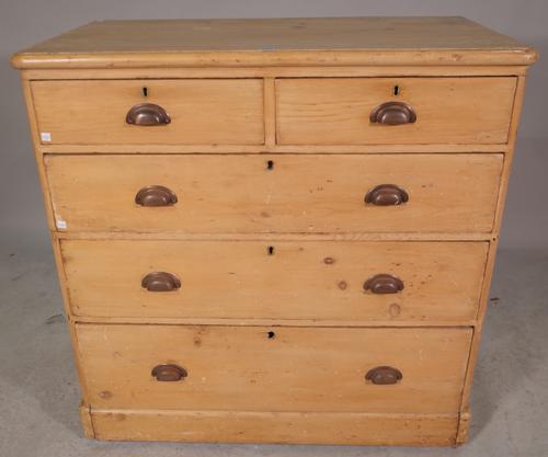 An early 20th century pine chest of two short and three long graduated drawers, 101cm wide x 101cm high.