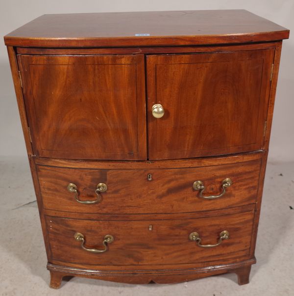 A George III mahogany bowfront commode/side table, with lift top over two dummy drawers, 65cm wide x 75cm high.