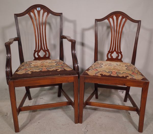 A set of six George III style mahogany shield back dining chairs, to include two carvers, (6).