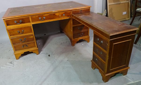 A 20th century stained beech pedestal desk with tooled brown leather top, 152cm wide x 75cm high.