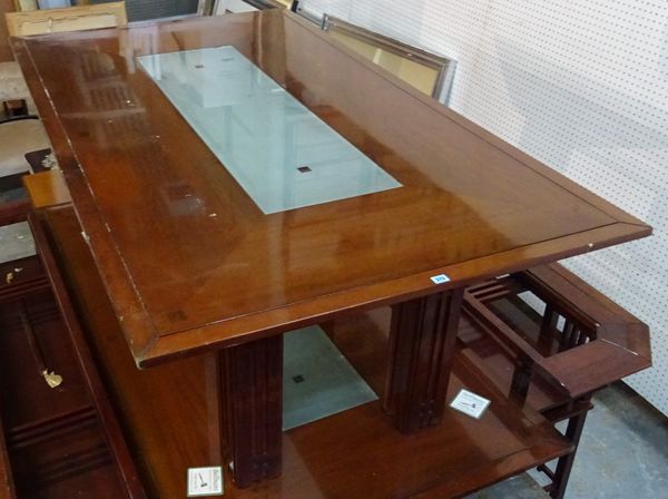 A 20th century stained beech rectangular dining table, with inset glass middle on block supports, 200cm long x 115cm wide x 76cm high.