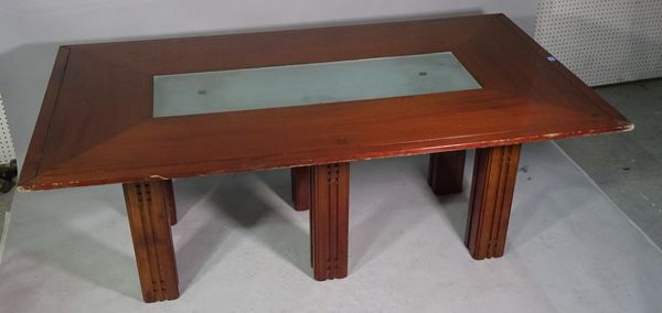 A 20th century stained beech rectangular dining table, with inset glass middle on block supports, 200cm long x 115cm wide x 76cm high.