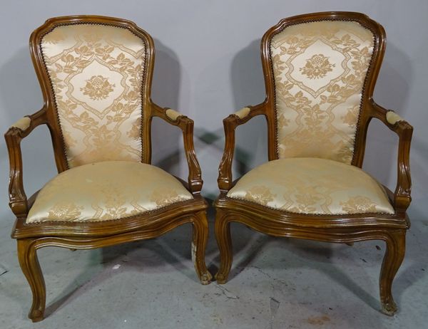 A pair of Victorian style stained beech open armchairs, on cabriole supports, (2).