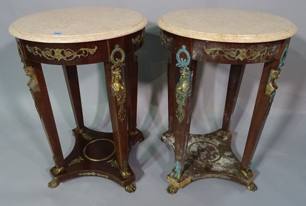 A pair of regency style stained beech and gilt metal mounted circular occasional tables, 48cm wide x 72cm high.