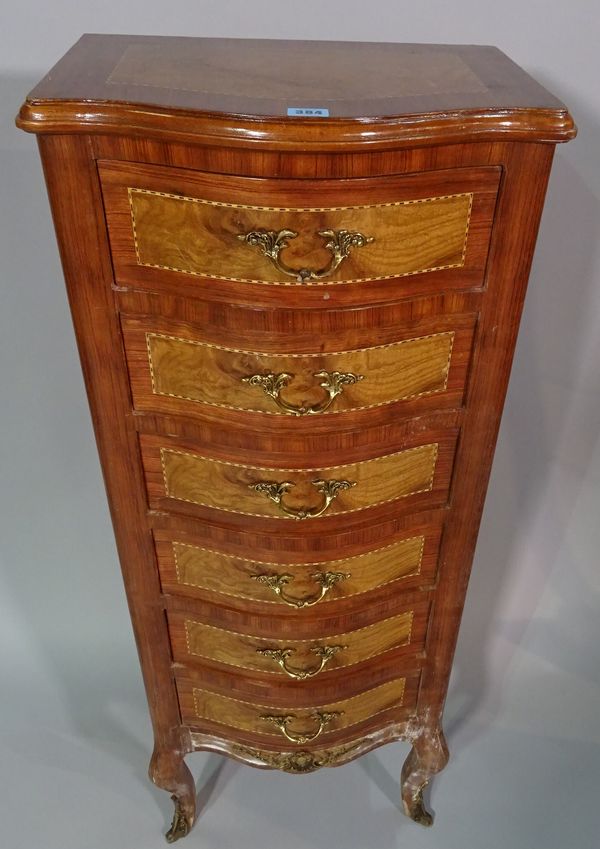 A Regency style hardwood serpentine tall chest, with six short drawers on cabriole supports, 45cm wide x 113cm high.