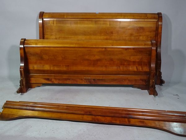 A 20th century hardwood sleigh bed, 163cm wide x 95cm high.