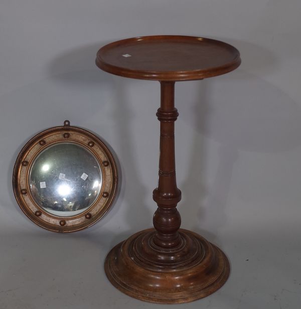 An early 20th century mahogany occasional table with dished top, on turned column 35cm wide x 62cm high and an early 20th century gilt convex mirror,