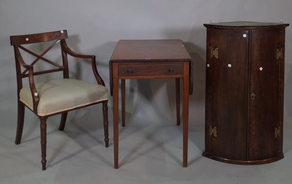 A late Edwardian mahogany Pembroke table, 83cm wide x 73cm high, a 19th century mahogany 'X' frame open armchair and a George III oak bowfront hanging