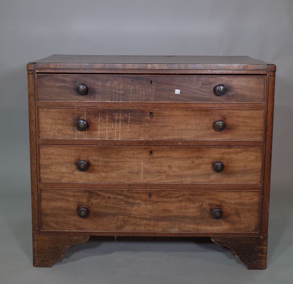 An early 19th century mahogany and ebony strong chest of four long graduated drawers on bracket feet, 97cm wide x 85cm high.