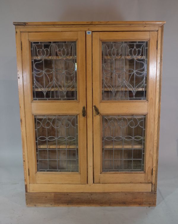 An art Nouveau style pine two door display cabinet, 120cm wide x 160cm high.