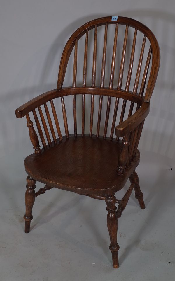 A Victorian ash and elm stickback open armchair.