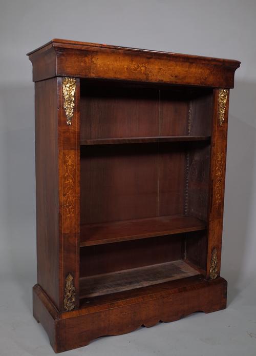 A Victorian walnut and ormolu mounted open bookcase on plinth base, 77cm wide x 105cm high.