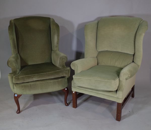 A 20th century hardwood framed wingback armchair, on block supports and another on cabriole supports, (2).