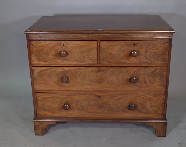 A George III style oak chest of two short and two long drawers on bracket feet, 106cm wide x 87cm high.