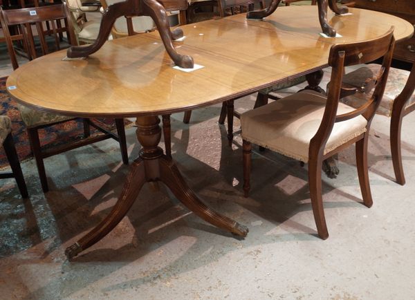 A George III style mahogany twin pedestal D-end dining table, 98cm wide x 75cm high x 264cm fully extended.