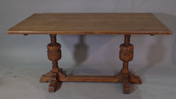 An 18th century style oak refectory table, on bulbous turned supports, 152cm long x 98cm wide x 75cm high.