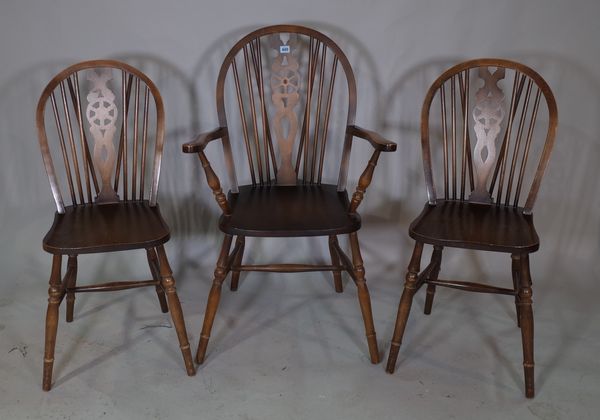 A set of eight 20th century stained beech wheelback dining chairs, to include two carvers, (8).