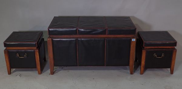 A 20th century hardwood framed and faux black leather upholstered trunk, 90cm x 55cm high and two smaller matching trunks, each 36cm wide x 40cm high,