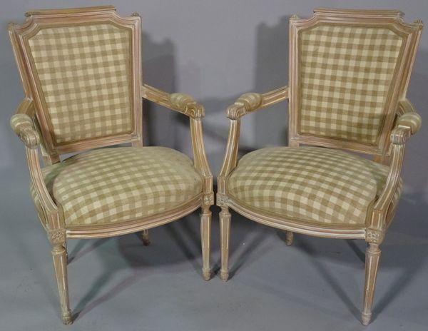 A pair of 20th century limed wood armchairs, with checkered upholstery, (2).