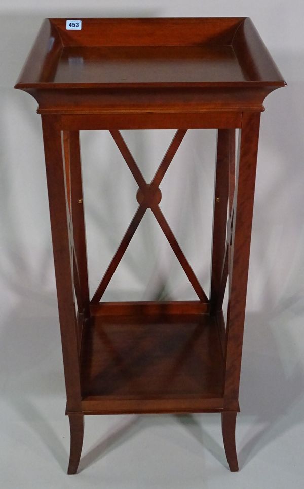 Harrods a 20th century walnut two tier occasional table, with fret cut sides and galleried top, 46cm wide.