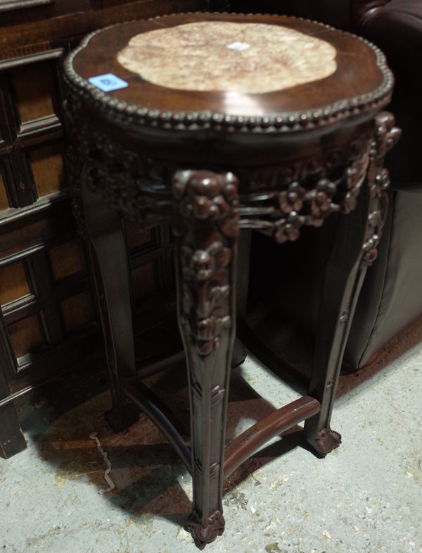 An early 20th century Chinese hardwood table, with marble inset top, 33cm wide x 62cm high.