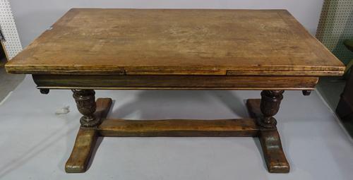 An 18th century style oak draw leaf dining table on turned bulbous carved supports, united by stretcher, 153cm long x 78cm high x 259cm fully extended