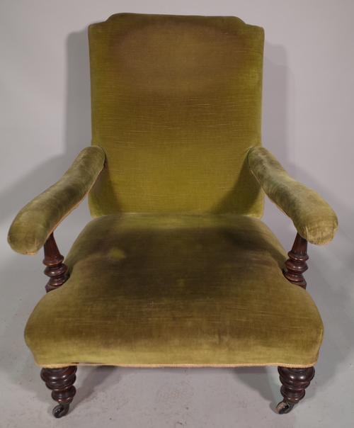 A Victorian mahogany framed low open armchair with green upholstery and a similar Victorian low armchair, (2).
