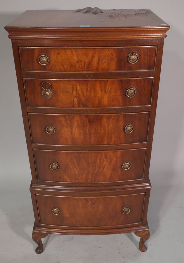 A 20th century mahogany bowfront narrow chest, with five long graduated drawers, raised on cabriole supports, 51cm wide x 105cm high.