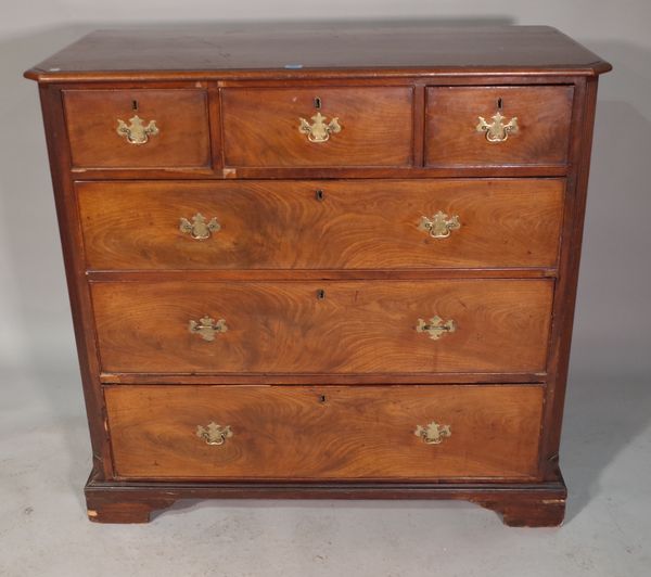 A George III mahogany chest of three short and three long graduated drawers with canted fluted edges on bracket feet, 118cm wide x 110cm high.