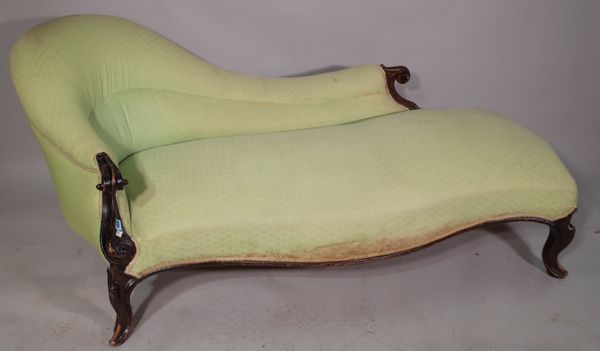 A Victorian mahogany framed spoonback chaise lounge of serpentine outline, 185cm wide x 75cm high.