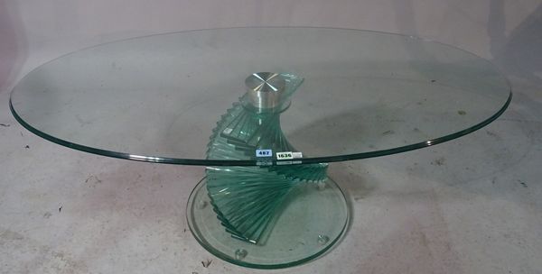 A 20th century oval glass coffee table, 120cm wide x 66cm diameter.