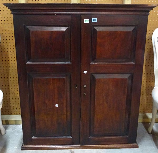 A mid-18th century mahogany hanging cupboard with pair of double raised panel doors enclosing a fitted interior, 94cm wide x 103cm high.