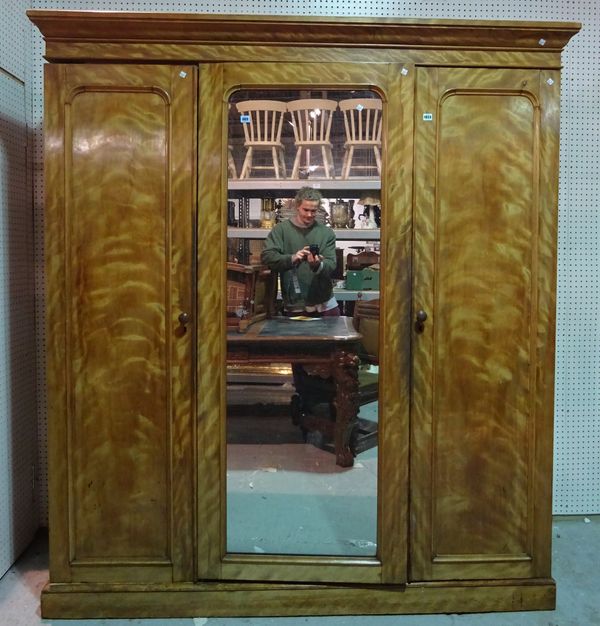 A Victorian satin birch compactum wardrobe with centre mirrored door, 188cm wide x 209cm high.