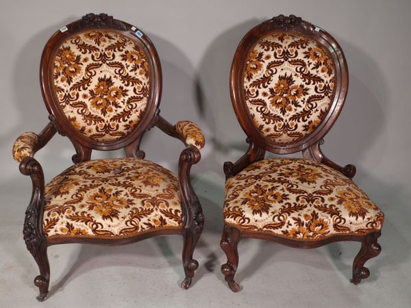 A Victorian walnut framed gentleman's open armchair, with serpentine seat on floral carved scroll supports, 75cm wide x 100cm high, together with a ma