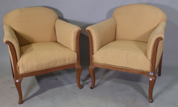 A pair of 20th century French beech upholstered tub chairs on cabriole supports, (2).