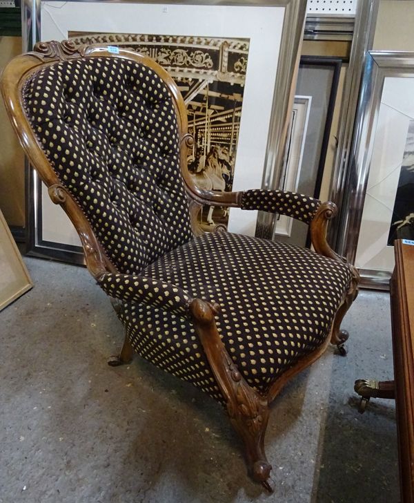 A Victorian mahogany framed open armchair with serpentine seat on scroll supports, 66cm wide x 90cm hihg.