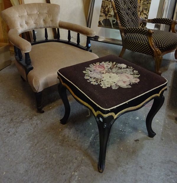 A Victorian ebonised tub back chair, 65cm wide x 72cm high and a 19th century ebonsied footstool of serpentine outline, 48cm wide x 44cm high.