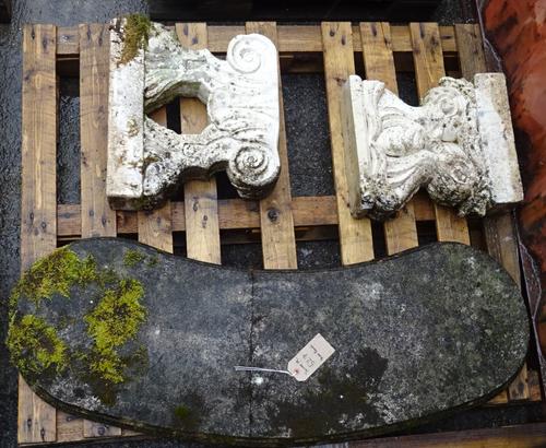 An early 20th century reconstituted stone curved garden bench on associated pedestal base, 117cm wide x 44cm high.