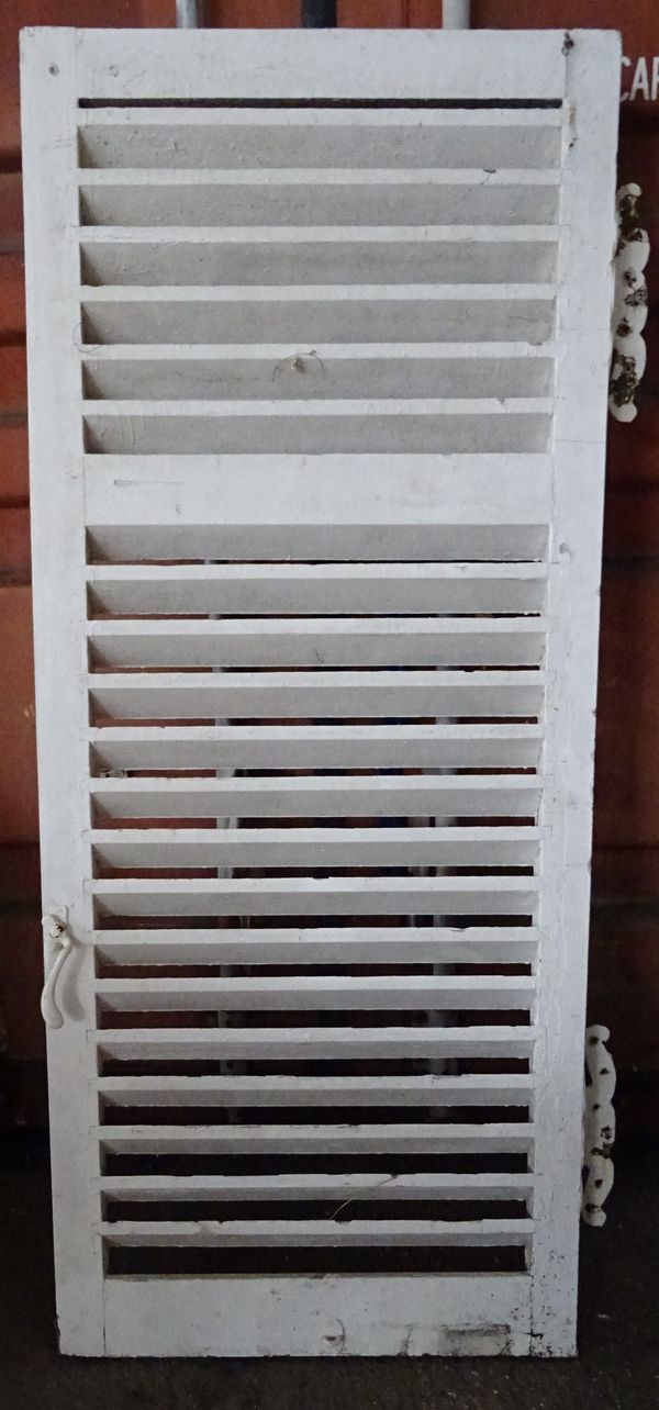 A set of four early 20th century white painted slatted shutter doors with butterfly hinges, 71cm wide x 172cm high, (4).