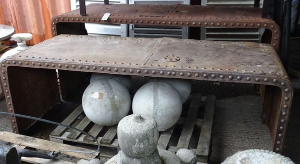 An early 20th century wrought iron studded console table, 210cm wide x 90cm high and another smaller 209cm wide x 78cm high, (2).