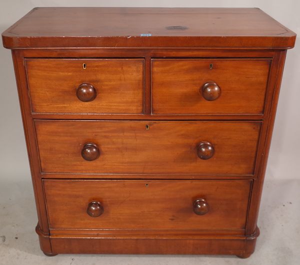 A Victorian mahogany chest of two short and two long drawers with bun handles, 91cm wide x 91cm high.