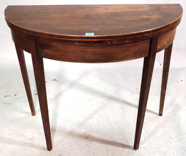 A George III mahogany bowfront card table on square tapering supports, 91cm wide x 72cm high.