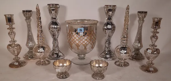 A quantity of modern silvered 'Mercury' glass ware comprising; three pairs of candlesticks, 33.5cm high, a pair of garnitures, a footed bowl, 24.5cm h
