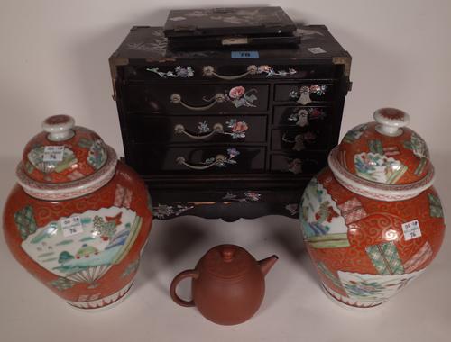 A 20th century Chinese black lacquer table top collector's chest with mother of pearl inlaid decoration, 27cm wide x 27cm high, (a.f.), a 20th century