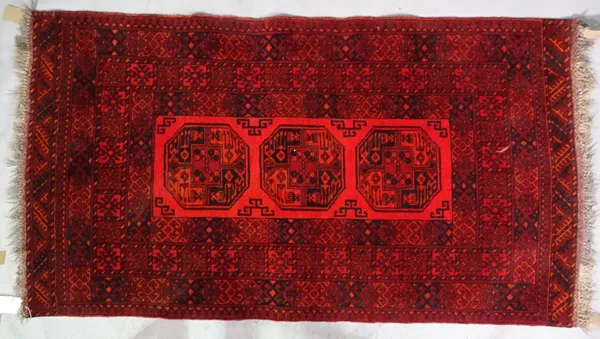 An Afghan rug, 197cm x 108cm.