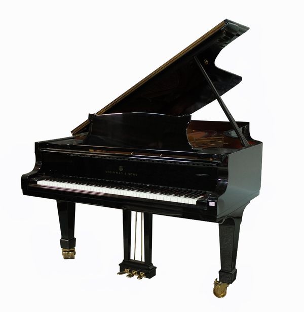 Steinway & Sons; an ebonised model D Concert grand piano, circa 1999, serial number 552181, with adjustable piano bench, made in Hamburg, 261 x 152cm.