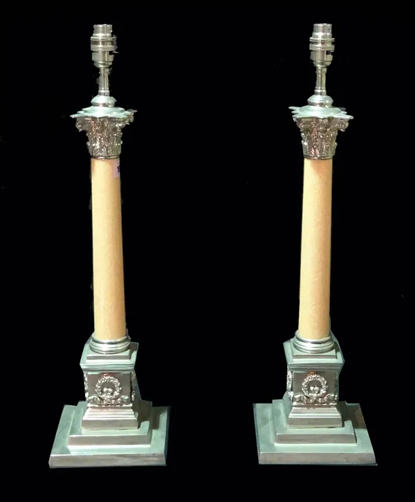 A pair of 20th century Corinthian column table lamps with chrome mounts and pink granite columns, 59cm high. (2)  Provenance; property from the late S