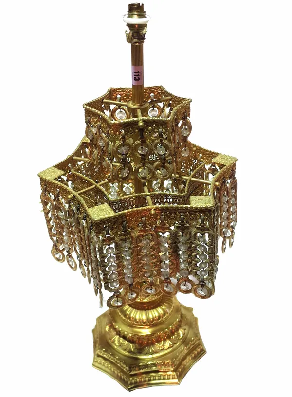 A pair of 20th century gilt metal table lamps hung with glass drops, each 72cm high. (2)  Provenance; property from the late Sir David TangThis lot ha